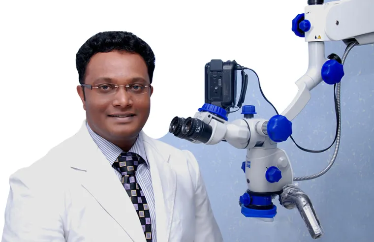Prof. Dr. Vinod Kumar beside a Carl Zeiss operating microscope